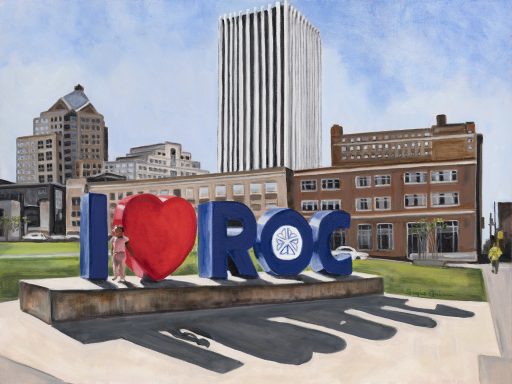 Colorful "I ❤️ ROC" sign in front of buildings against a blue sky backdrop.