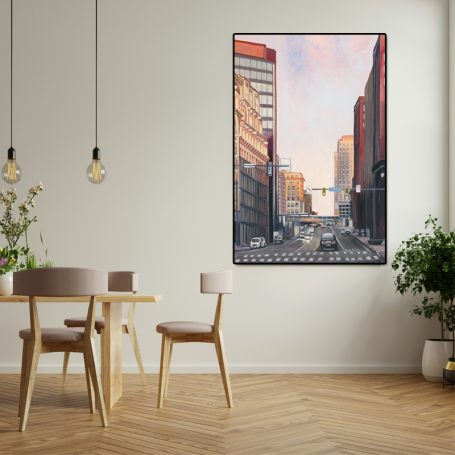 City street view at dusk with tall buildings and traffic lights.